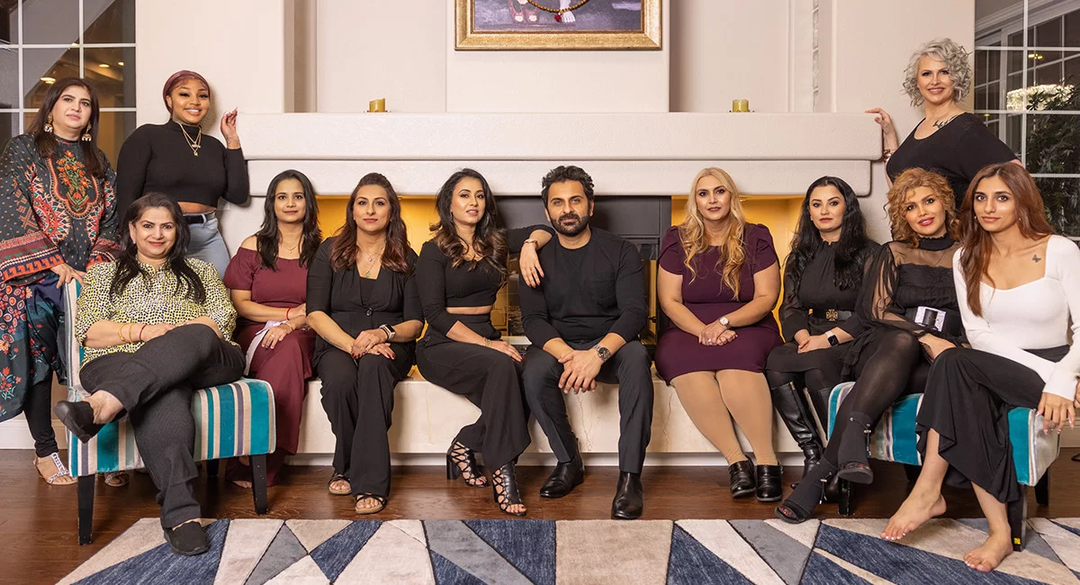 Las Vegas Divine Teams consulting group and leadership team posing together during a corporate event in a luxury office setting