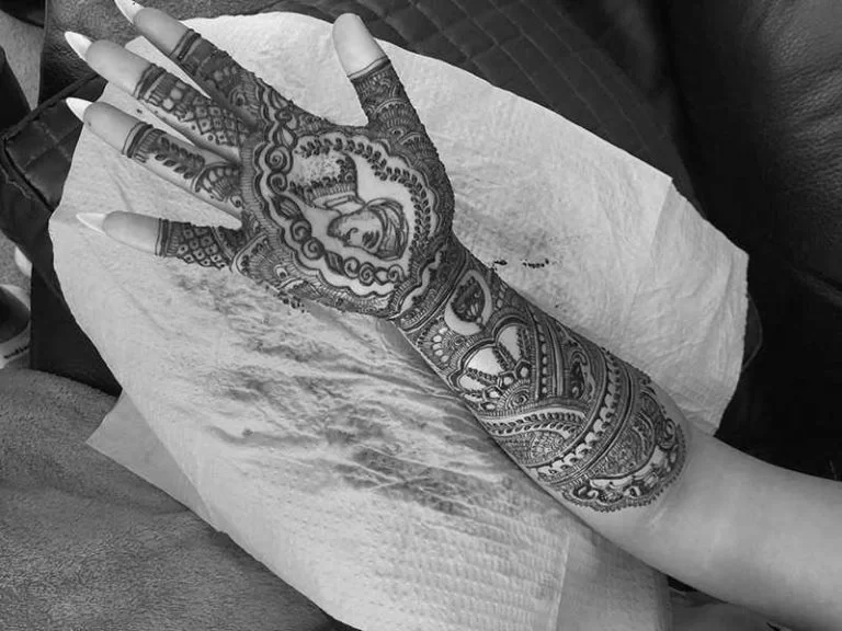 Divine Threading intricate bridal henna design featuring a custom portrait and detailed Mehndi art.