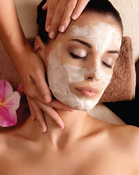 Professional facial treatment for glowing skin at Divine Threading and Lash Beauty Studio salon.